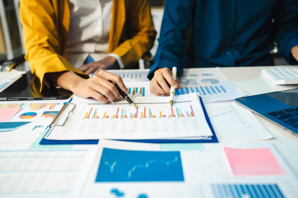 financial advisor showing plan of investment to clients in the consultancy.